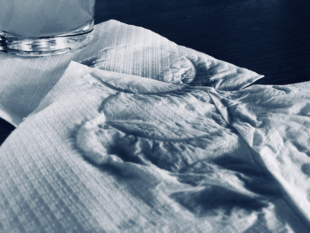 A napkin with water rings from a glass